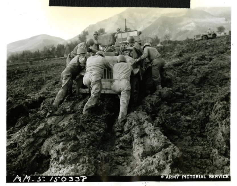 Soldiers push an American Jeep stuck in mud, Italy, 1943 | The Digital  Collections of the National WWII Museum : Oral Histories